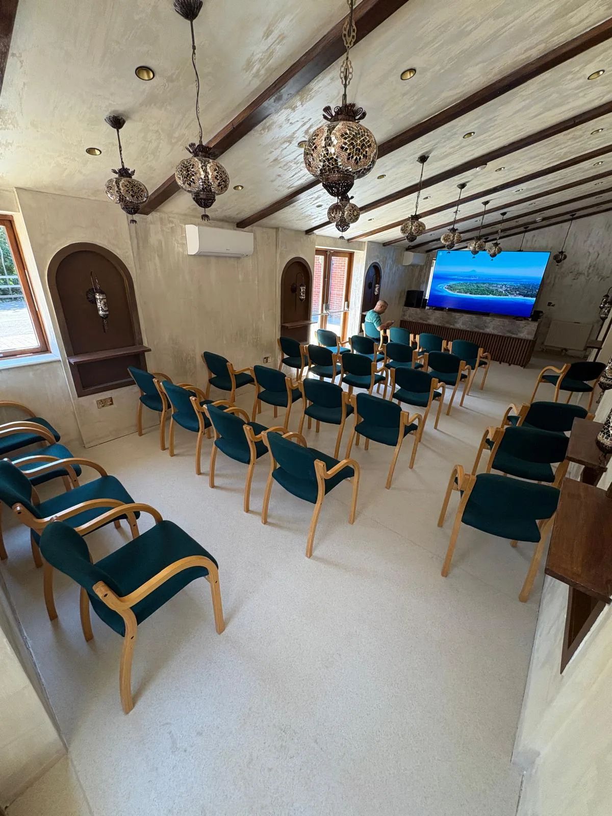 The hall set out with rows of chairs for a screening
